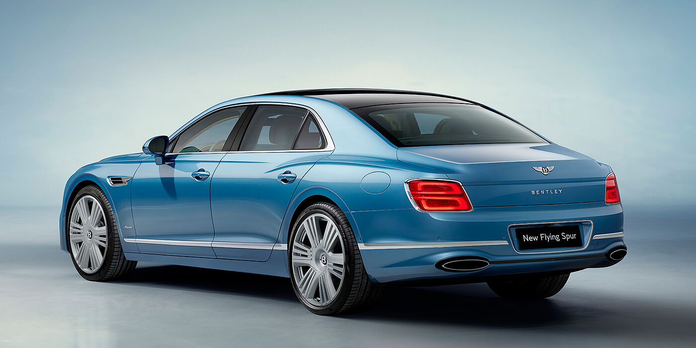 Bentley Essex (Chelmsford) New Bentley Flying Spur Azure sedan rear view in Light windsor blue by Mulliner paint with 22 inch Azure wheels and chrome exterior details