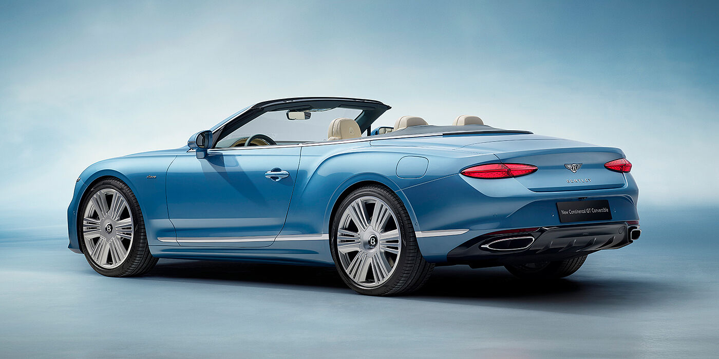 Bentley Essex (Chelmsford) New Bentley Continental GTC Azure convertible rear view in Light Windsor blue paint with 22 inch ten spoke wheels and chrome exterior details