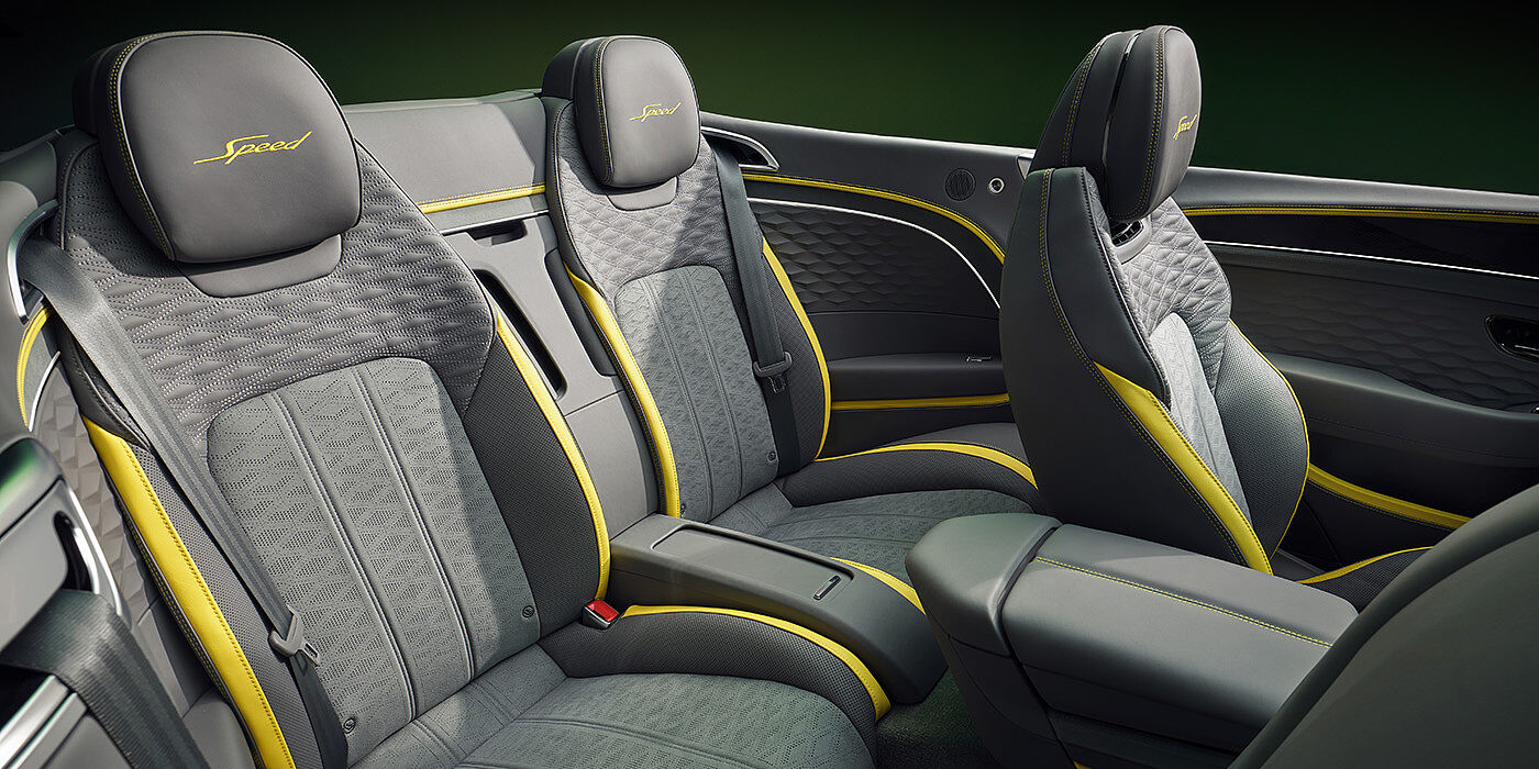 Bentley Essex (Chelmsford) Bentley New Continental GTC Speed convertible rear interior with unique Speed colour split in Gravity Grey and Cyber Yellow hide colours, and contrast stitched headrest emblems 
