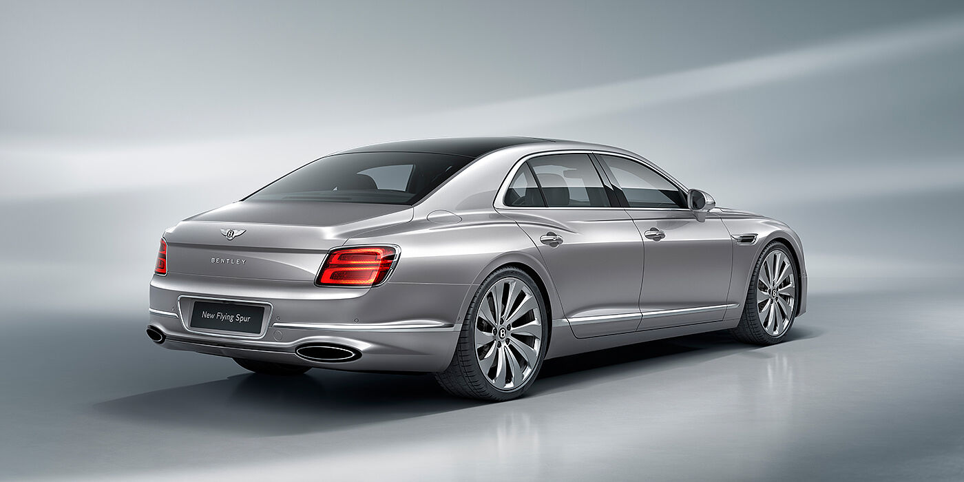 Bentley Essex (Chelmsford) New Bentley Flying Spur sedan rear view in Silverlake paint with ten spoke wheels and chrome matrix grille