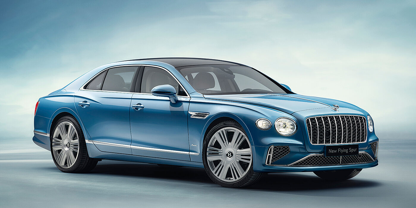 Bentley Essex (Chelmsford) New Bentley Flying Spur Azure sedan front view in Light windsor blue by Mulliner paint with 22 inch Azure wheels and chrome exterior details
