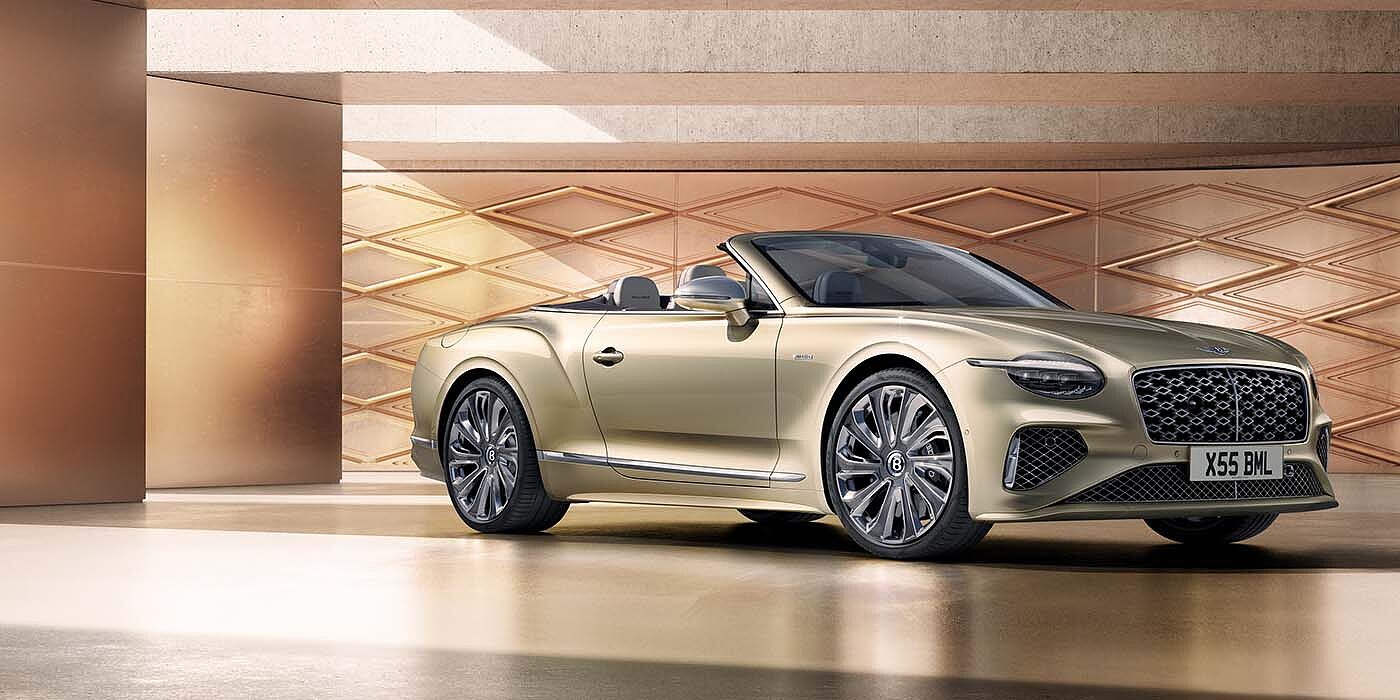 Bentley Essex (Chelmsford) Bentley New Continental GTC Mulliner V8 hybrid front three quarters in Patina paint