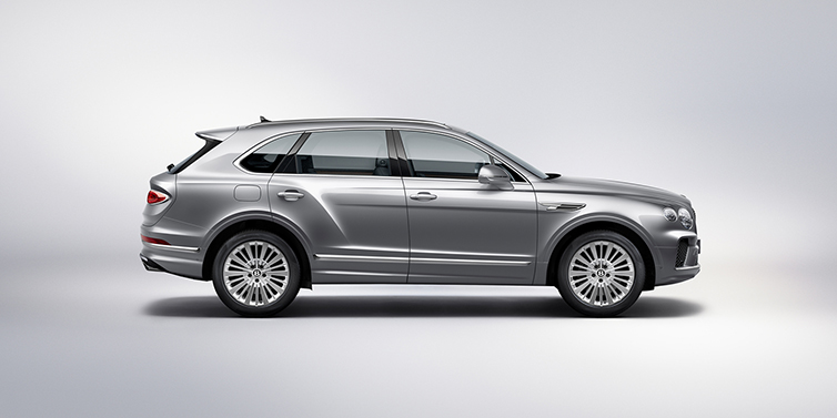 Bentley Essex (Chelmsford) Bentley Bentayga SUV side profile in Moonbeam silver paint against white background featuring 21 inch 5 spoke wheels