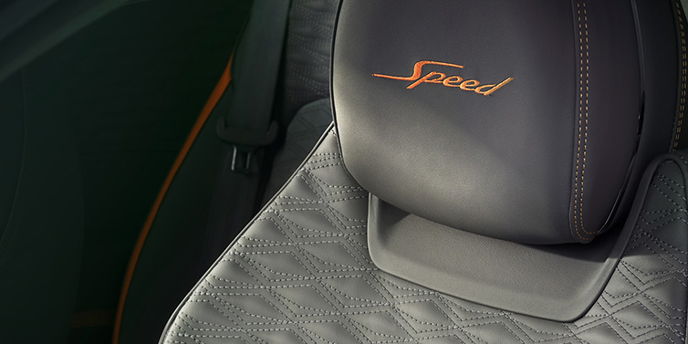 Bentley Essex (Chelmsford) Bentley Continental GT Speed coupe seat detail in Gravity Grey hide and Speed emblem in Mandarin by Mulliner coloured embroidery